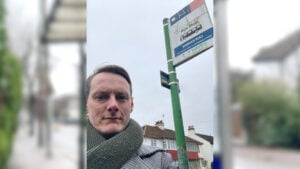 Simon at a bus stop